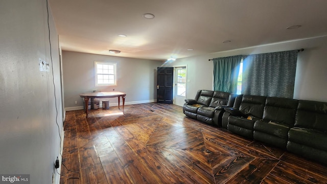 living area featuring baseboards
