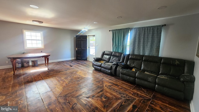 living room with baseboards and recessed lighting