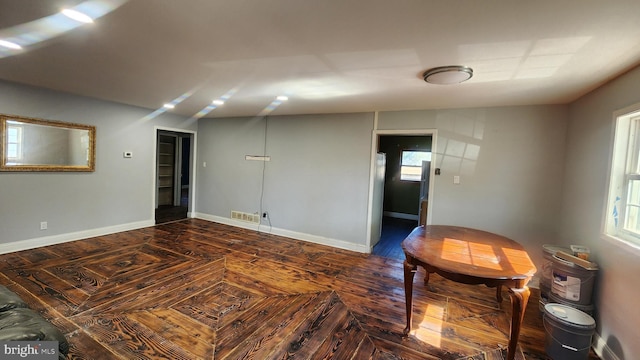unfurnished room with visible vents and baseboards