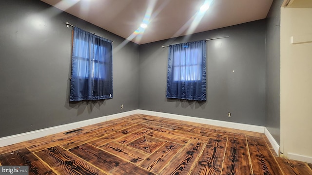 spare room with visible vents and baseboards