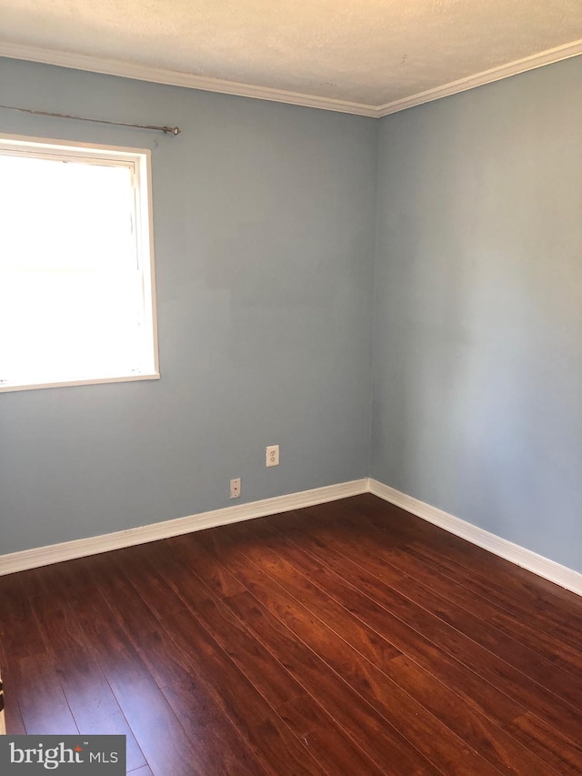 132 Evans St, Manassas Park, VA 20111 - empty room with baseboards, ornamental molding, and dark wood-style floors