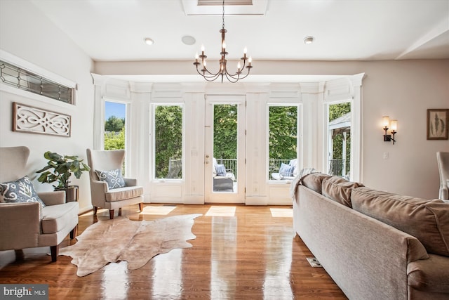 10601 Little Run Farm Ct, Vienna, VA 22182 - living room with recessed lighting, an inviting chandelier, a healthy amount of sunlight, and wood finished floors
