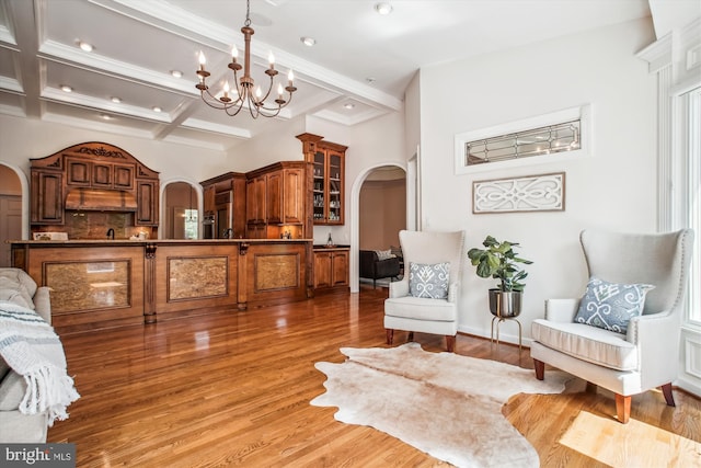 10601 Little Run Farm Ct, Vienna, VA 22182 - living area featuring a notable chandelier, light wood-style floors, arched walkways, recessed lighting, and beamed ceiling