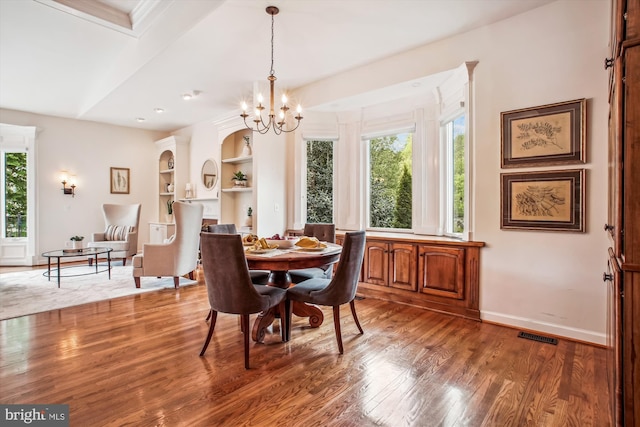 10601 Little Run Farm Ct, Vienna, VA 22182 - dining room featuring a chandelier, built in features, baseboards, wood finished floors, and visible vents