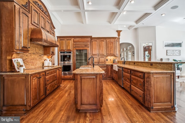 10601 Little Run Farm Ct, Vienna, VA 22182 - kitchen featuring arched walkways, stainless steel appliances, dark wood finished floors, beamed ceiling, and coffered ceiling