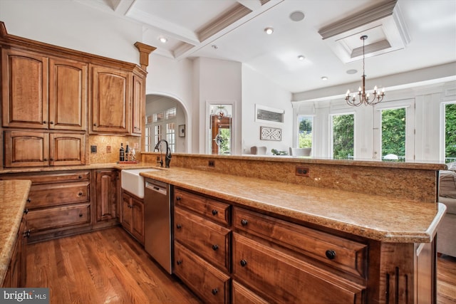 10601 Little Run Farm Ct, Vienna, VA 22182 - kitchen with stainless steel dishwasher, wood finished floors, a chandelier, brown cabinets, and a sink