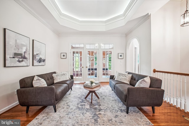 10601 Little Run Farm Ct, Vienna, VA 22182 - living area with arched walkways, ornamental molding, a tray ceiling, and wood finished floors