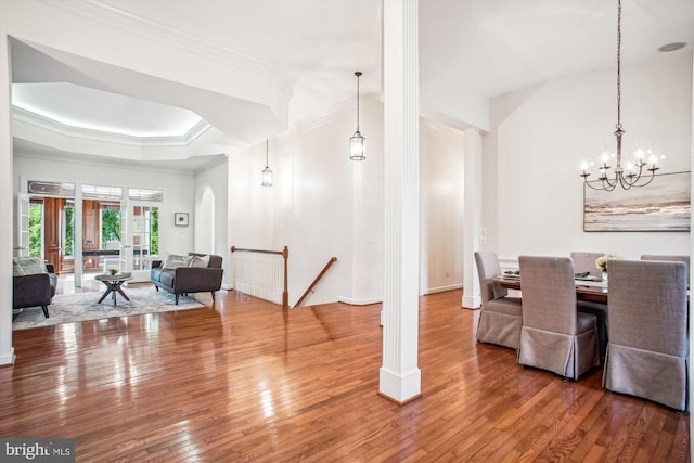 10601 Little Run Farm Ct, Vienna, VA 22182 - dining area with crown molding, baseboards, an inviting chandelier, ornate columns, and hardwood / wood-style floors