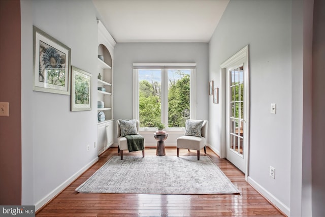 10601 Little Run Farm Ct, Vienna, VA 22182 - sitting room featuring baseboards, built in features, and wood finished floors