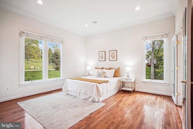 10601 Little Run Farm Ct, Vienna, VA 22182 - bedroom featuring crown molding, baseboards, visible vents, and light wood-style floors