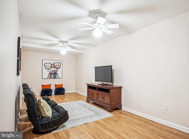 10601 Little Run Farm Ct, Vienna, VA 22182 - living area with baseboards, a ceiling fan, and light wood-type flooring
