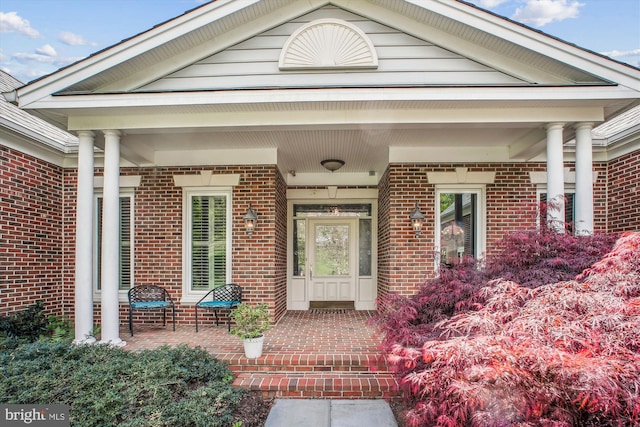 10601 Little Run Farm Ct, Vienna, VA 22182 - view of exterior entry featuring covered porch and brick siding
