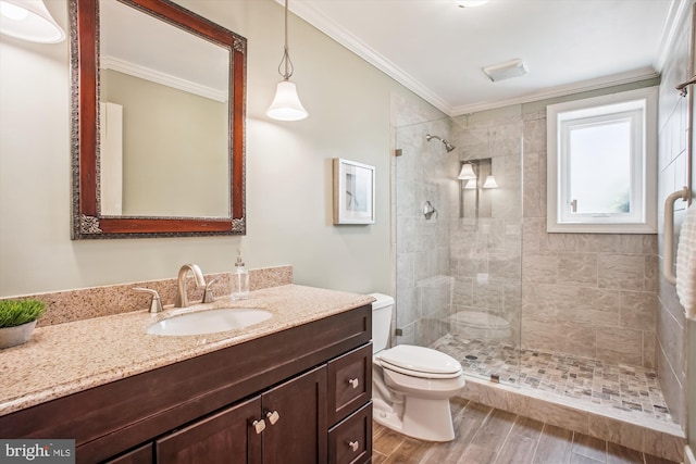 10601 Little Run Farm Ct, Vienna, VA 22182 - bathroom with crown molding, vanity, toilet, wood finished floors, and tiled shower