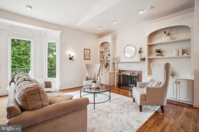 10601 Little Run Farm Ct, Vienna, VA 22182 - living area featuring baseboards, built in features, wood finished floors, and a fireplace