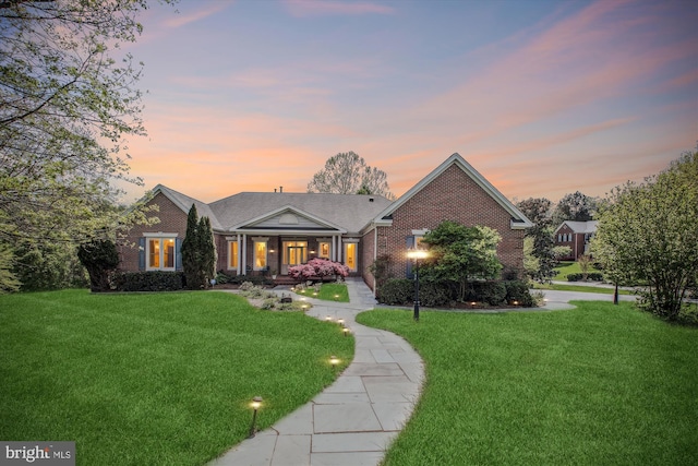 10601 Little Run Farm Ct, Vienna, VA 22182 - view of front of home with brick siding, a front yard, and a porch