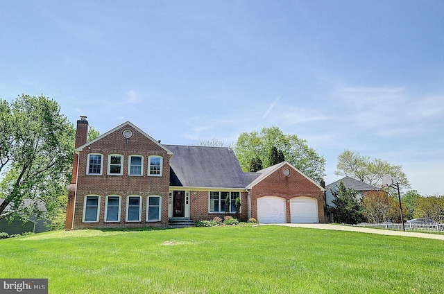 view of front facade with a garage, brick siding, a chimney, and concrete driveway