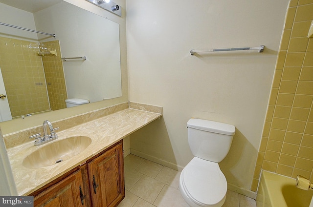 bathroom with toilet, tile patterned floors, vanity, and baseboards