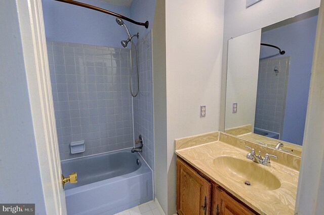 bathroom with shower / tub combination, vanity, and tile patterned flooring