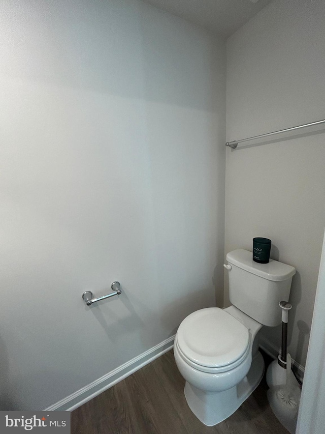 1108 Dovetail Cir, Fredericksburg, VA 22401 - bathroom with wood finished floors, toilet, and baseboards