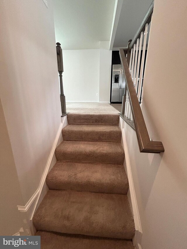 1108 Dovetail Cir, Fredericksburg, VA 22401 - staircase featuring carpet floors and baseboards