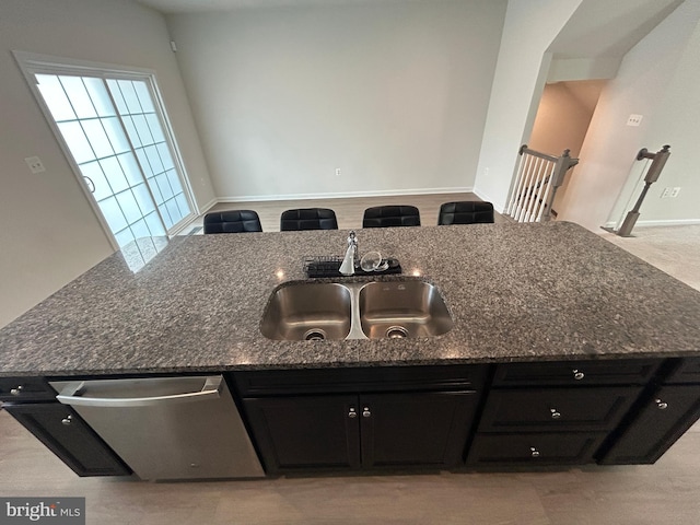 1108 Dovetail Cir, Fredericksburg, VA 22401 - kitchen featuring a sink, stainless steel dishwasher, dark stone countertops, and dark cabinets
