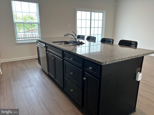 1108 Dovetail Cir, Fredericksburg, VA 22401 - kitchen featuring a sink, stainless steel dishwasher, an island with sink, light wood-type flooring, and baseboards