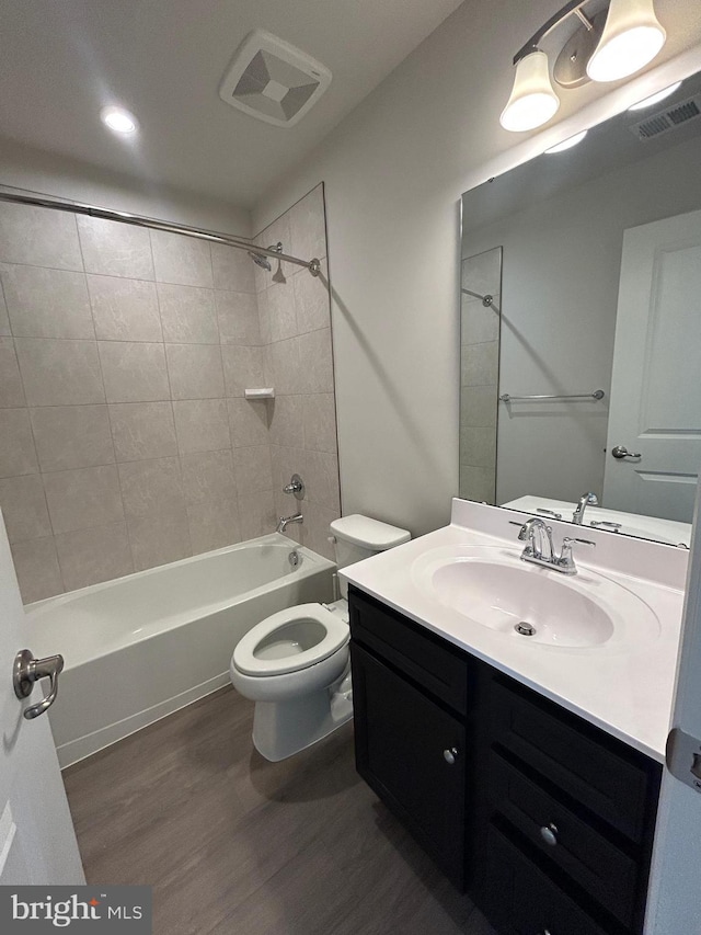 1108 Dovetail Cir, Fredericksburg, VA 22401 - full bath with wood finished floors, toilet, vanity, and shower / tub combination