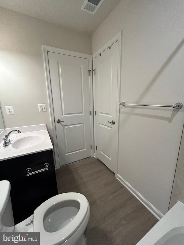 1108 Dovetail Cir, Fredericksburg, VA 22401 - bathroom featuring toilet, wood finished floors, and vanity