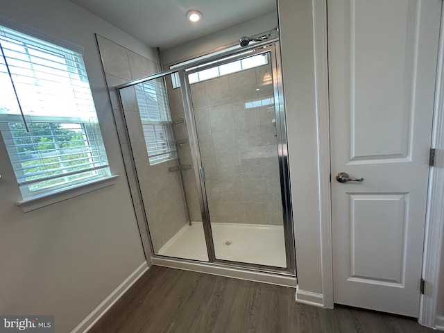 1108 Dovetail Cir, Fredericksburg, VA 22401 - bathroom featuring healthy amount of natural light, a shower stall, and wood finished floors