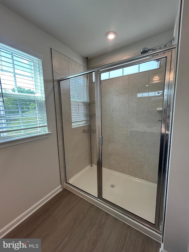 1108 Dovetail Cir, Fredericksburg, VA 22401 - full bath featuring wood finished floors, a stall shower, and baseboards