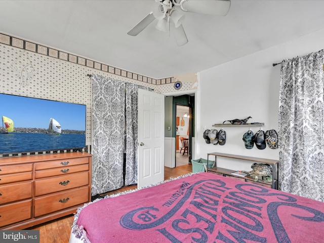 bedroom featuring ceiling fan and wood finished floors