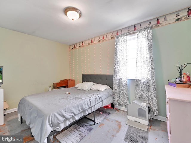 bedroom featuring baseboards