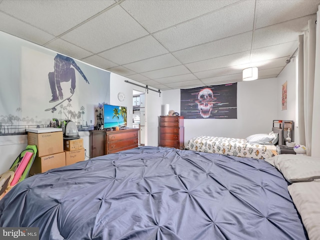 bedroom with a paneled ceiling