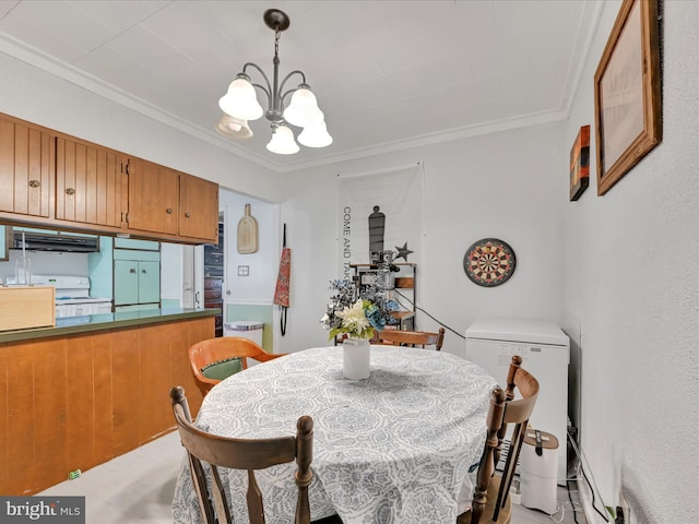 dining area with crown molding and a chandelier