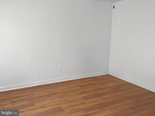 1523 17th St SE, Washington, DC 20020 - spare room featuring wood finished floors and baseboards