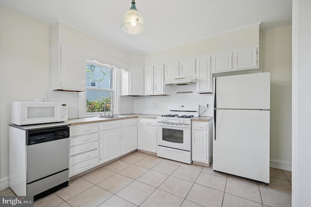 kitchen with under cabinet range hood, light countertops, a sink, and white appliances