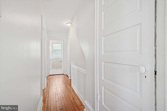 hallway featuring hardwood / wood-style flooring