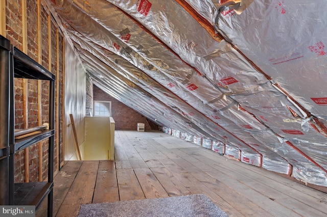 attic featuring an upstairs landing