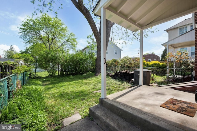 view of yard with a fenced backyard and cooling unit