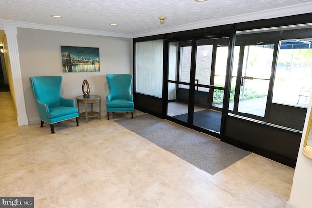 living area featuring a healthy amount of sunlight, ornamental molding, decorative columns, and recessed lighting