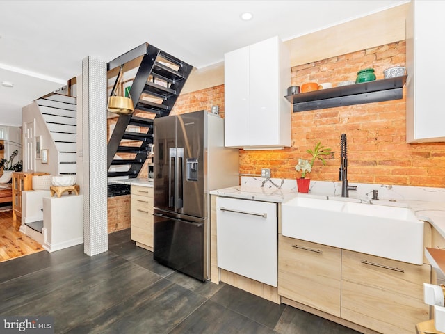 kitchen with a sink, stainless steel fridge with ice dispenser, open shelves, dark wood-style floors, and white cabinets