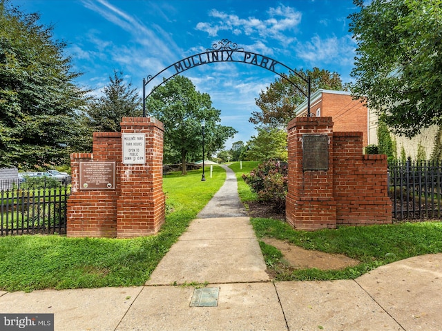 view of community featuring fence