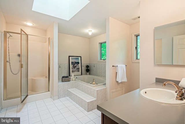 full bathroom featuring tile patterned flooring, vanity, a shower stall, visible vents, and a garden tub
