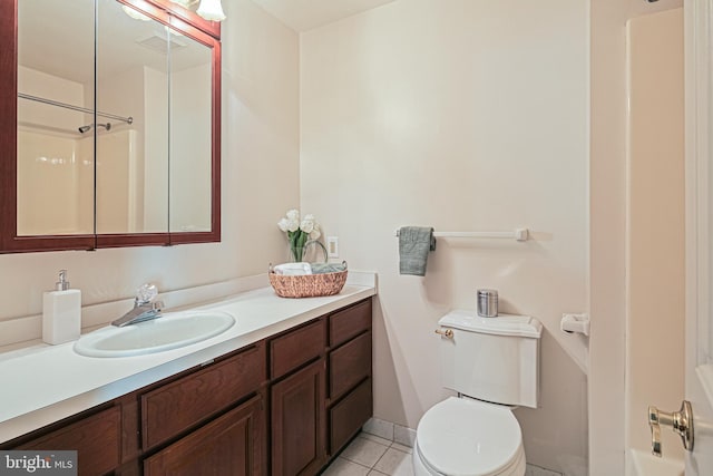 bathroom featuring vanity, toilet, and tile patterned floors