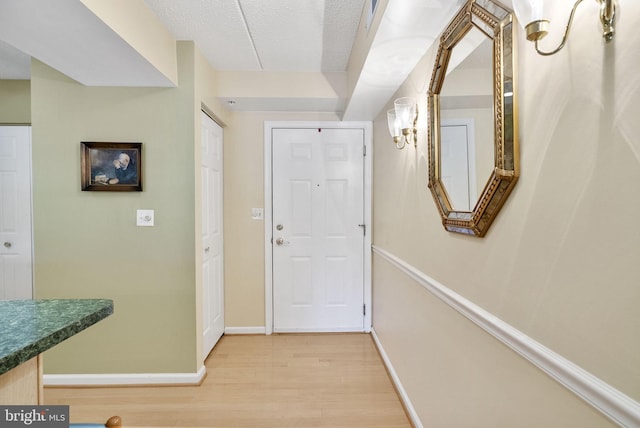 interior space with light wood-style floors and baseboards