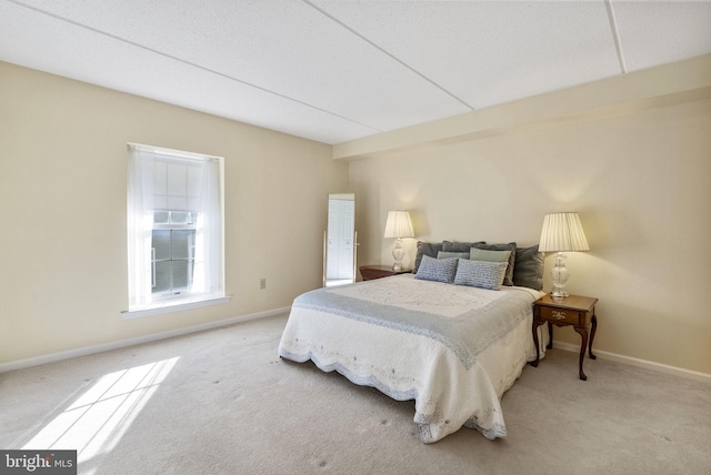 carpeted bedroom with baseboards