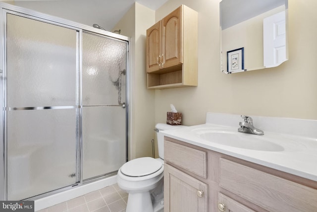 bathroom with vanity, a stall shower, and toilet