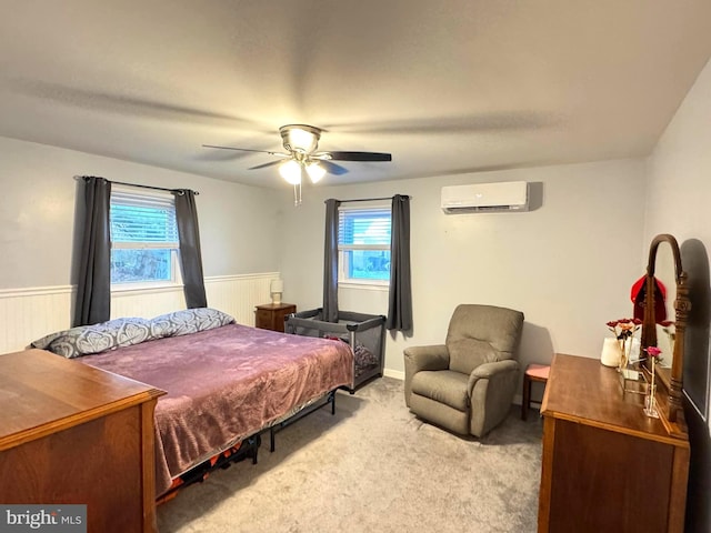918 Hillside Ave, Upper Chichester, PA 19061 - bedroom featuring an AC wall unit, carpet, ceiling fan, and wainscoting