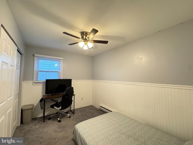 918 Hillside Ave, Upper Chichester, PA 19061 - bedroom with a wainscoted wall, a ceiling fan, a baseboard heating unit, and carpet floors