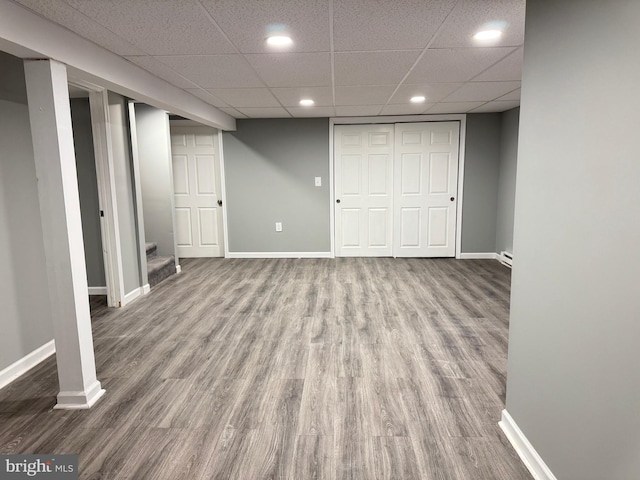 918 Hillside Ave, Upper Chichester, PA 19061 - finished below grade area with a paneled ceiling, stairs, recessed lighting, baseboards, and wood finished floors